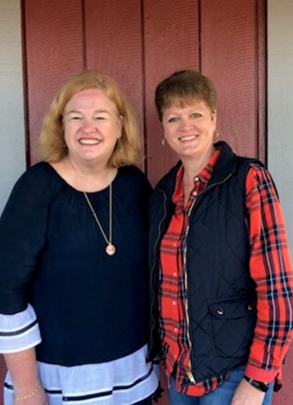 Rhonda Deloney Seay (FA) and Sandy Cook Reynolds (former BAP member) reconnected at an Auburn tailgate